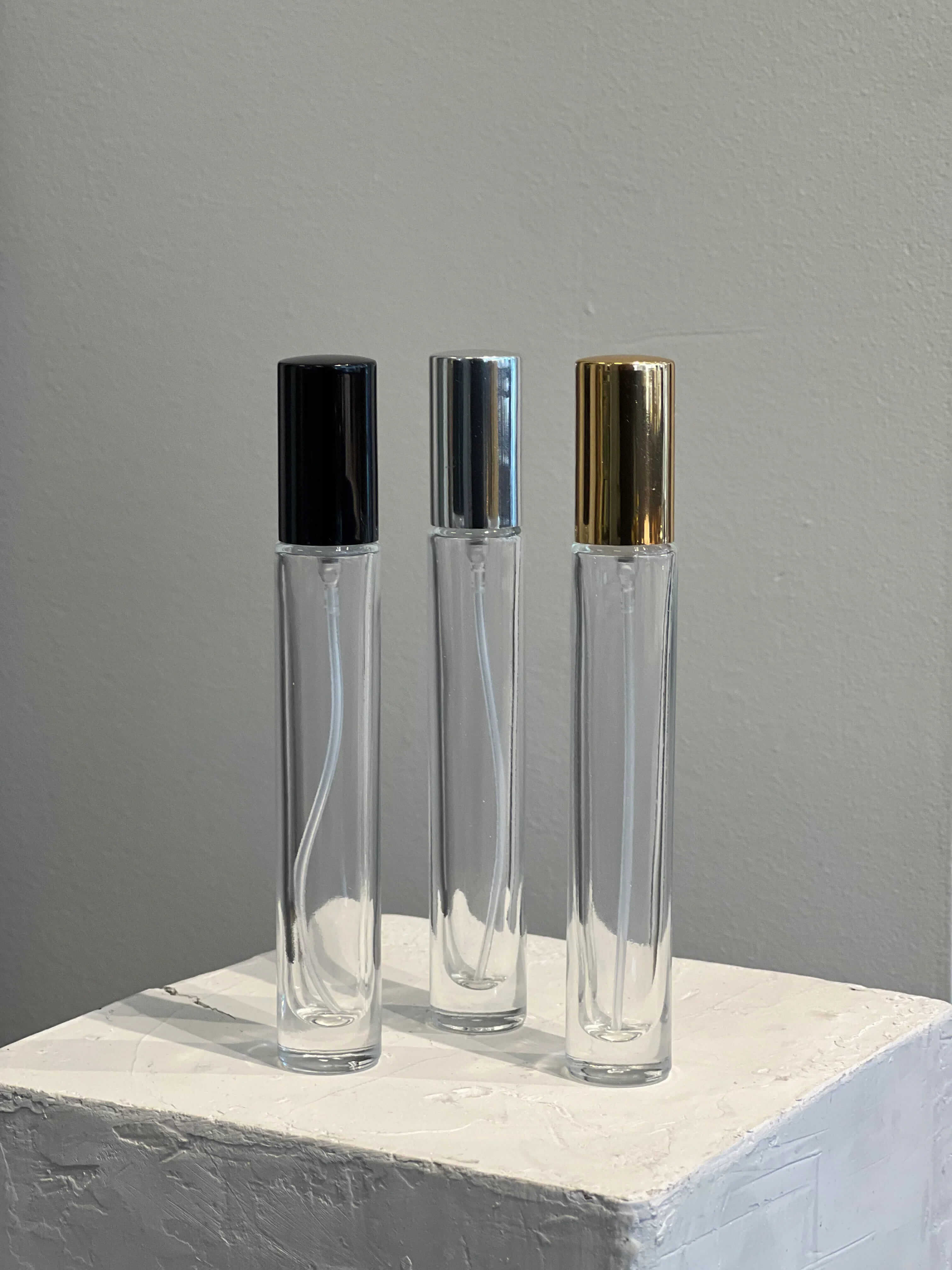 Extrait de Parfum with bold top notes of black pepper, pimento, and Italian red mandarin in a 10 ml spray