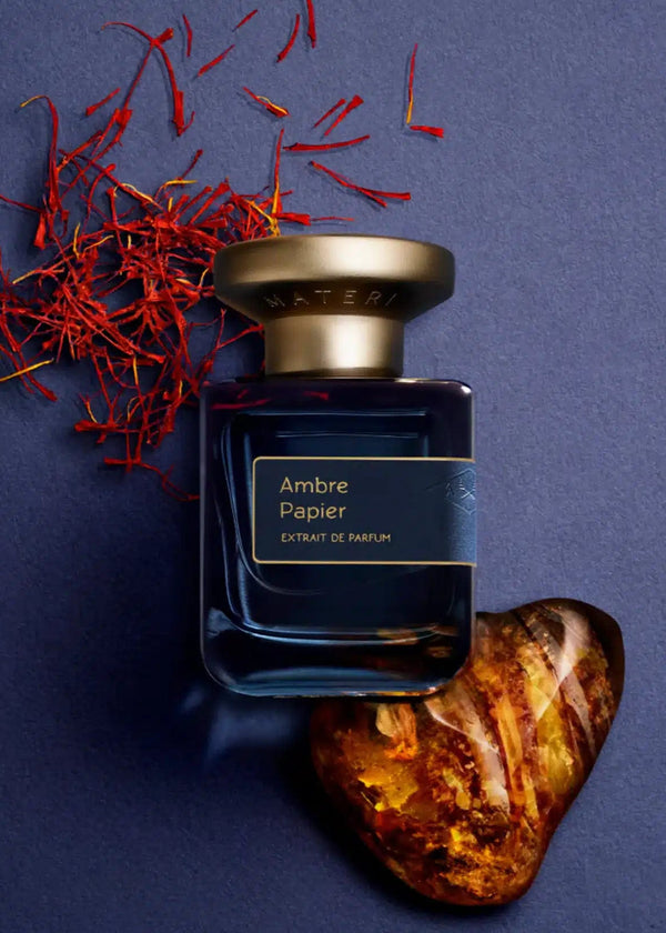 Ambre Papier Extrait de Parfum opens with a fresh burst of black pepper, red mandarin, and Jamaican pimento